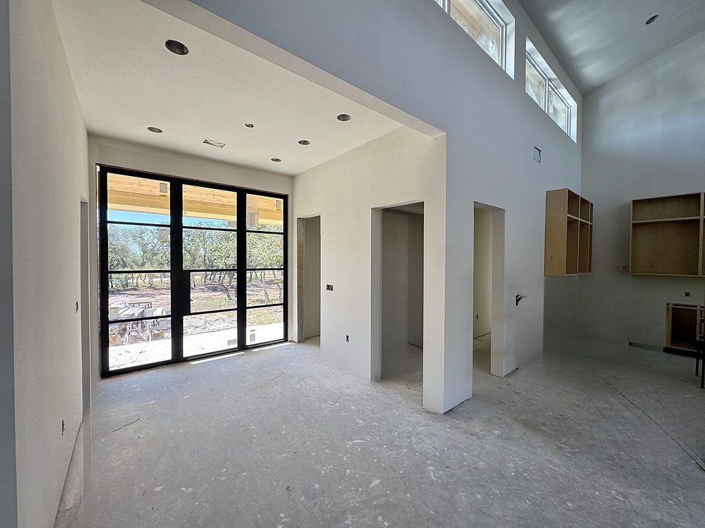 Real photo of black-framed glass doors under a vaulted ceiling at 168 Crooked Creek Court, October 2026