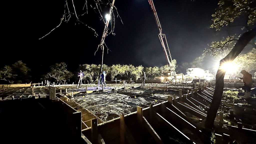 Real photo of the foundation concrete pour at night at 168 Crooked Creek Court, Johnson City, TX