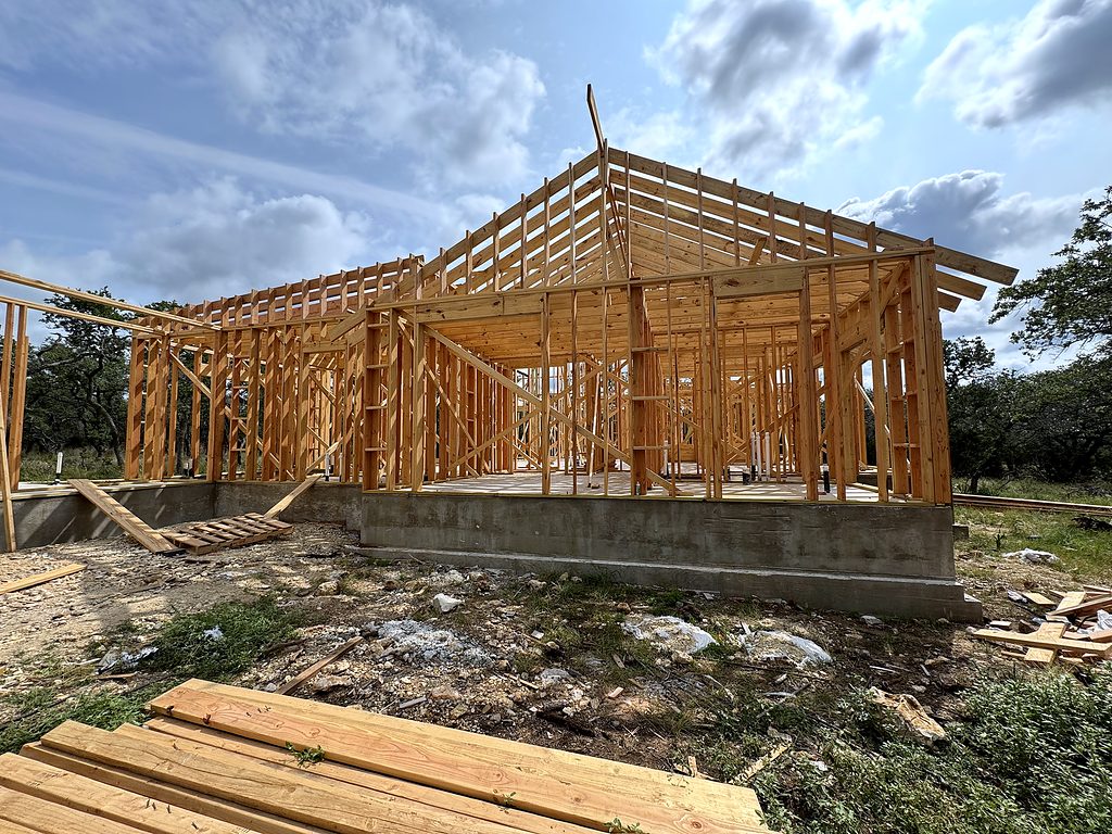 Real photo of wall framing on the slab at 168 Crooked Creek Court, Johnson City, TX, May 2025