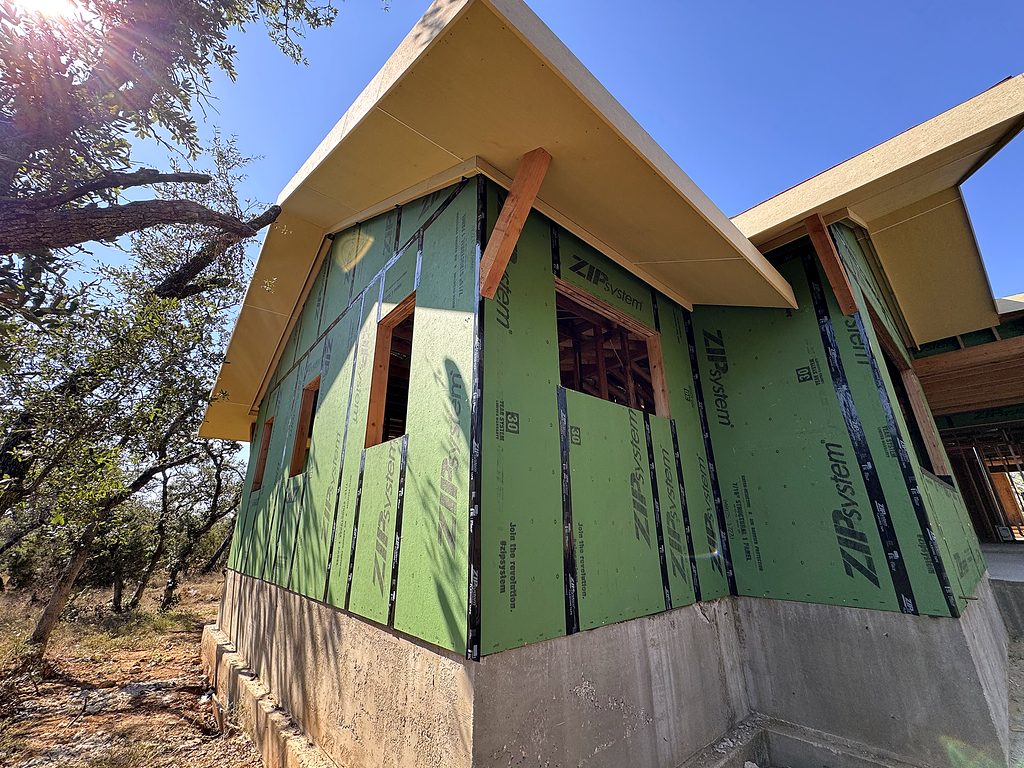 Real photo of Zip System sheathing and window openings at 168 Crooked Creek Court, Johnson City, TX, September 2025